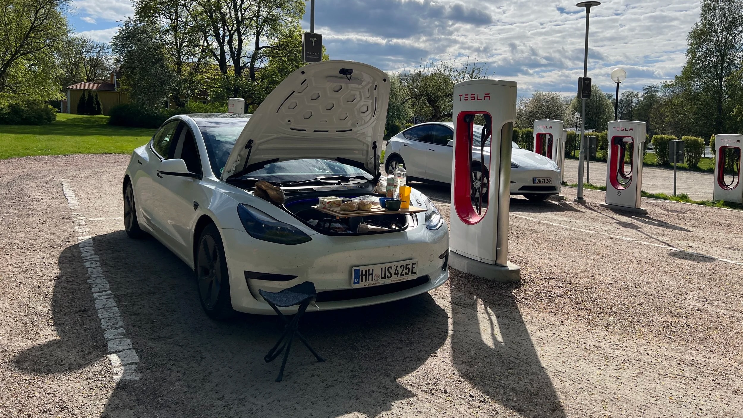 Frunkly table in use at a Tesla Supercharger